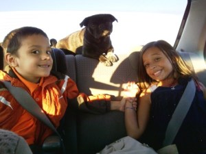 Choey in the back seat with the kids Choey
