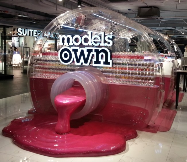 A nail polish store shaped like a bottle of nail polish!